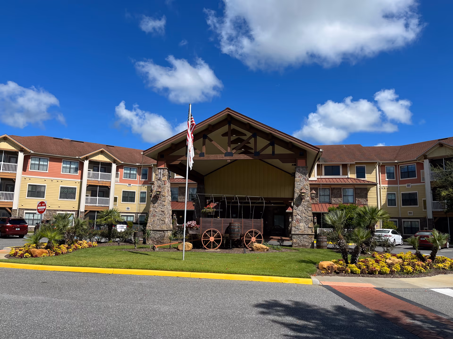 Exterior view of American House Wildwood showing the entrance and landscaped front
