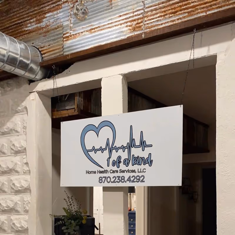 Interior entrance with a hanging sign advertising a home health care service.