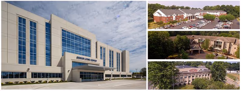 Exterior of a beige senior living campus with glass-front administration building and surrounding structures.