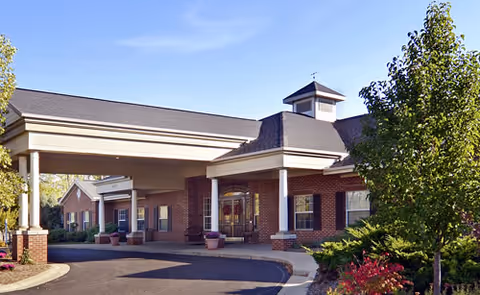 Exterior view of Everlasting Life Personal Care Home with brick entrance and planters.