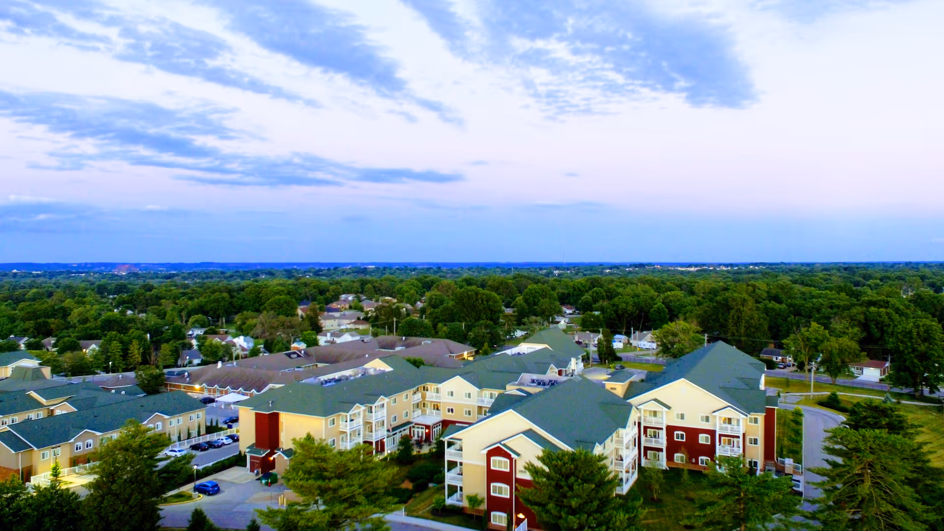 Aerial view of Nazareth Living Center campus with multi-story buildings and green surroundings