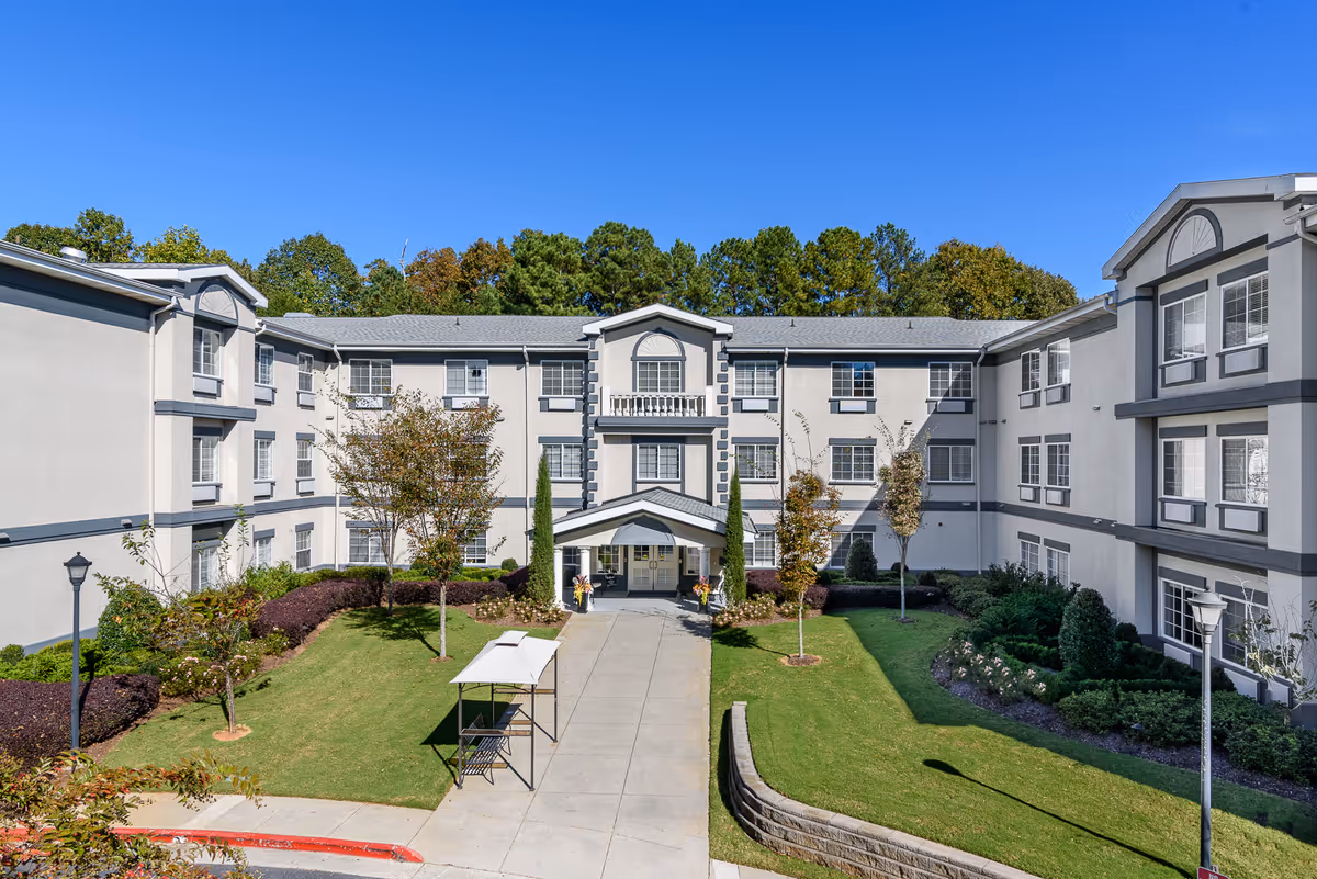 Exterior view of Maryann Adult Family Home showing a manicured lawn and central entrance.
