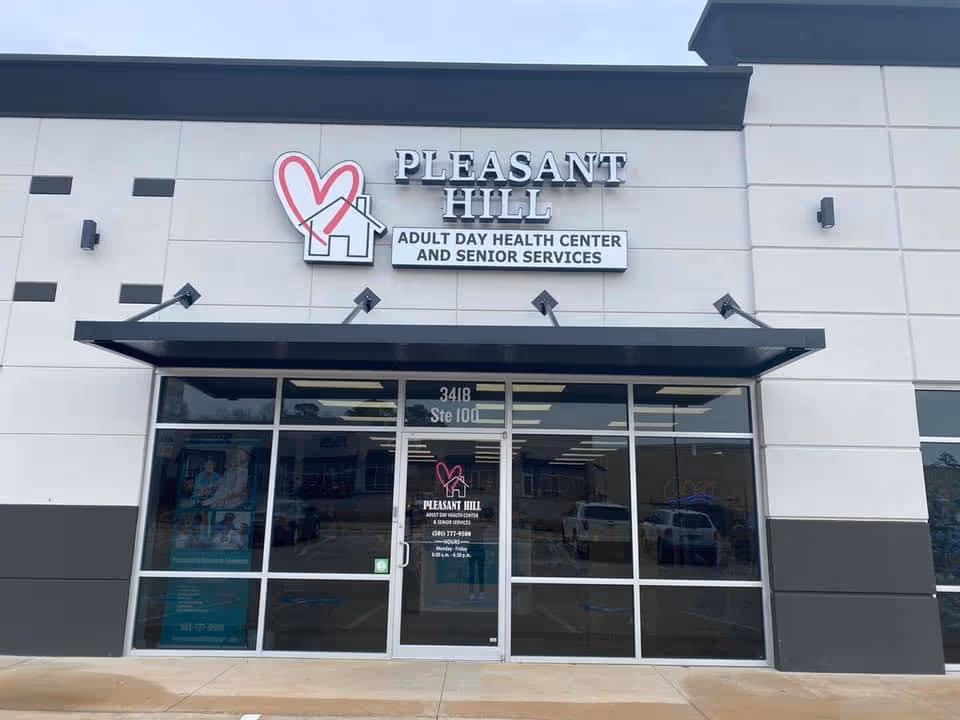 Front facade of Pleasant Hill Senior Services with glass doors and a prominent sign.