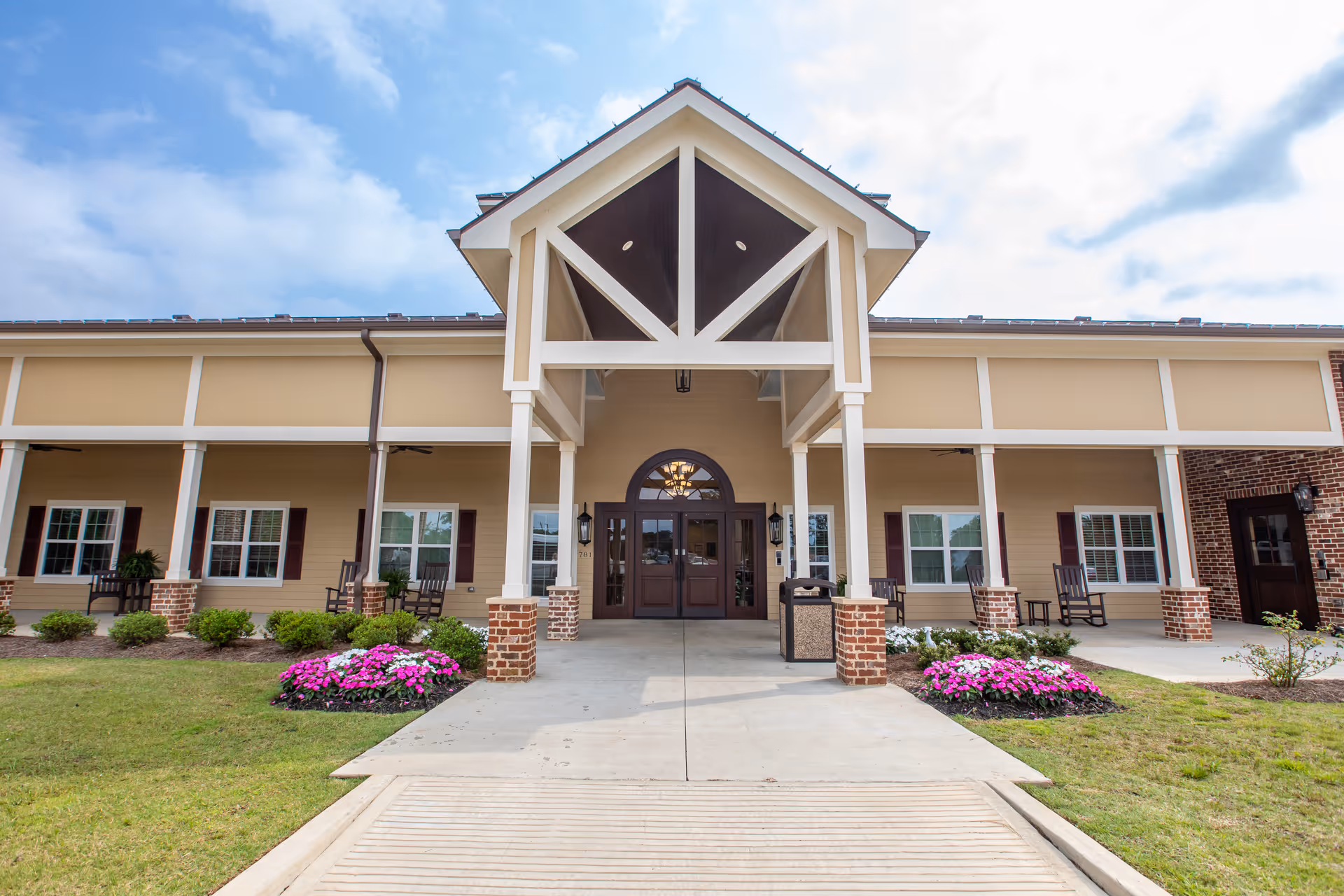 Front exterior of Natchitoches Community Care Center with a covered entrance and landscaped beds.