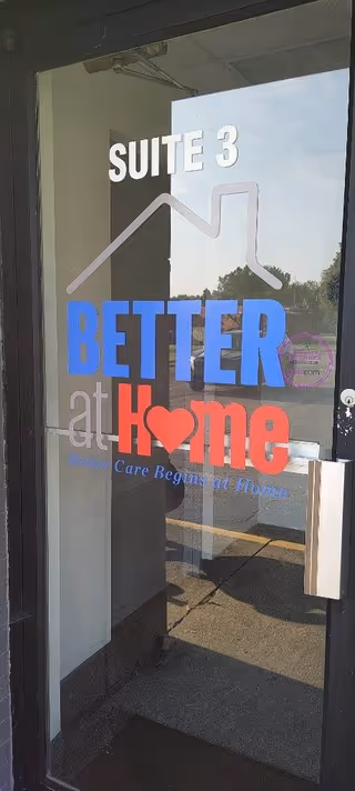 Glass entrance door displaying Suite 3 and Better at Home signage, with outdoor view beyond.
