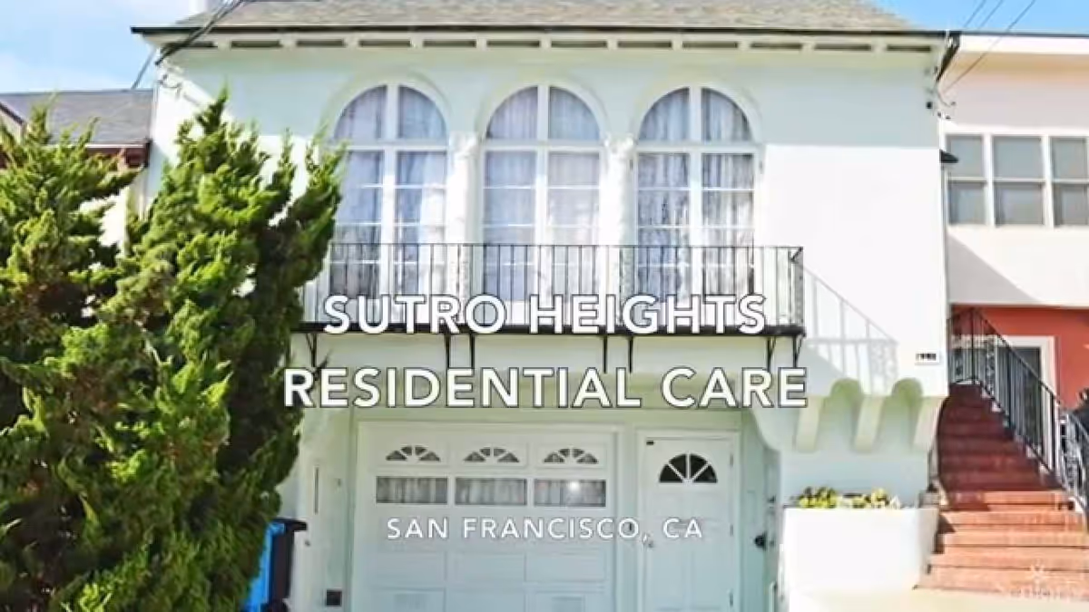 Front view of Sutro Heights Residential Care building with garage doors and stairs.