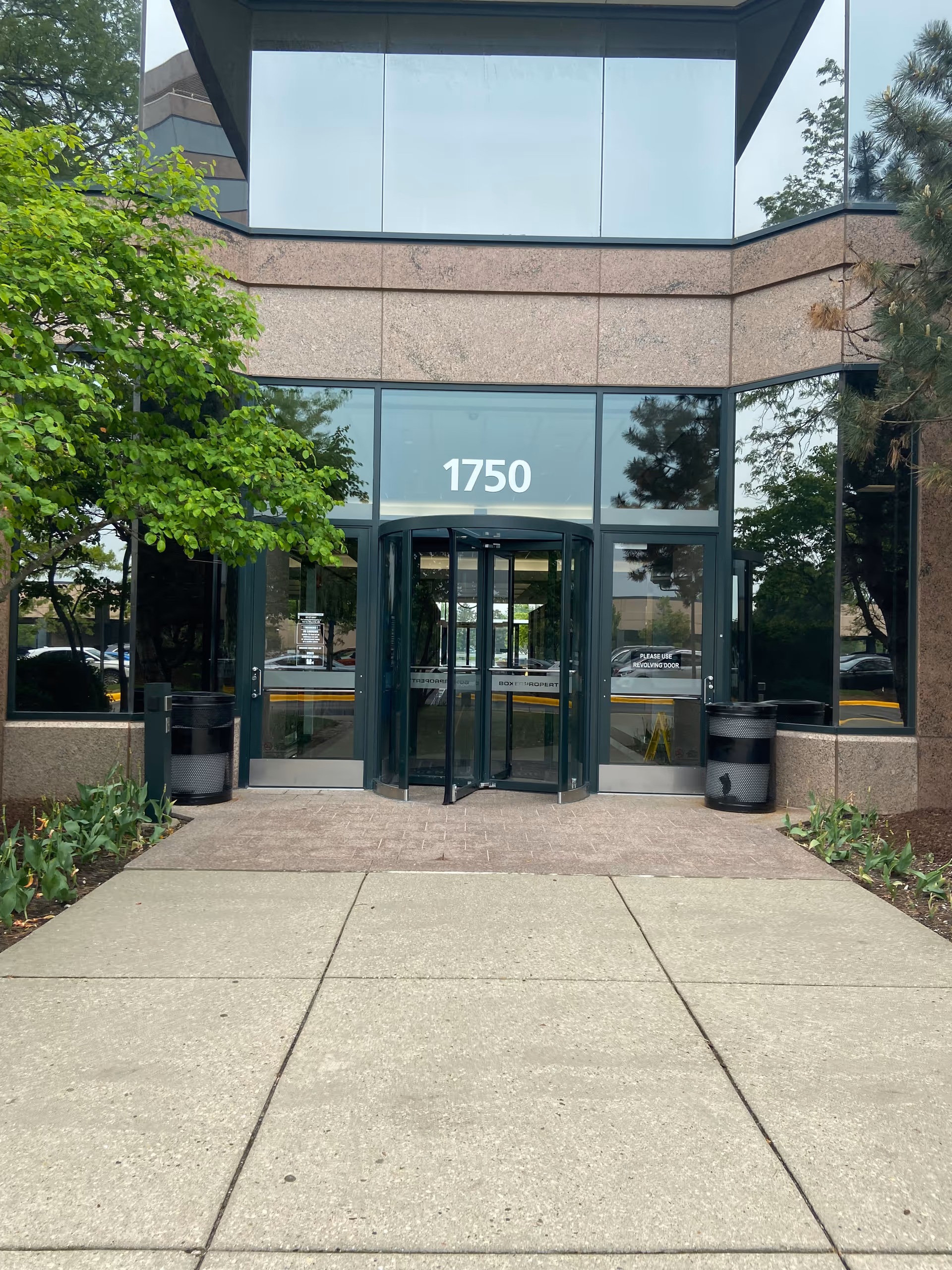 Exterior view of Joyful Homecare Solution, LLC building entrance with glass doors, address 1750.