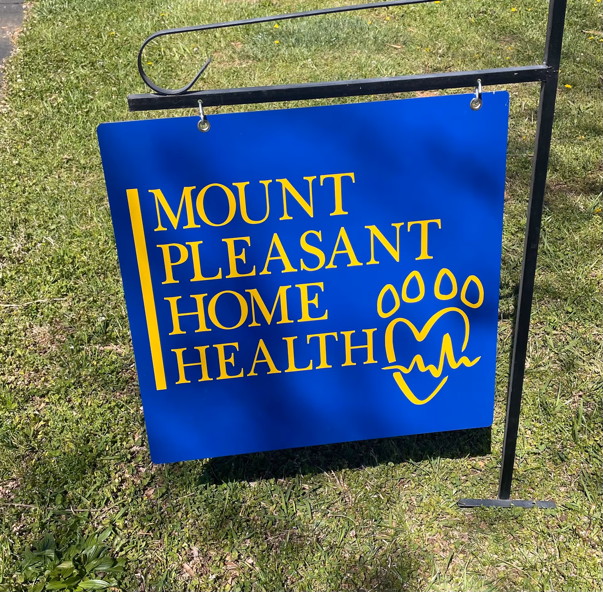 Blue Mount Pleasant Home Health sign on a grassy lawn outdoors