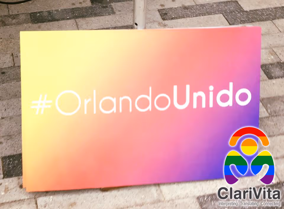 Colorful gradient sign on pavement displaying #OrlandoUnido and ClariVita logo.