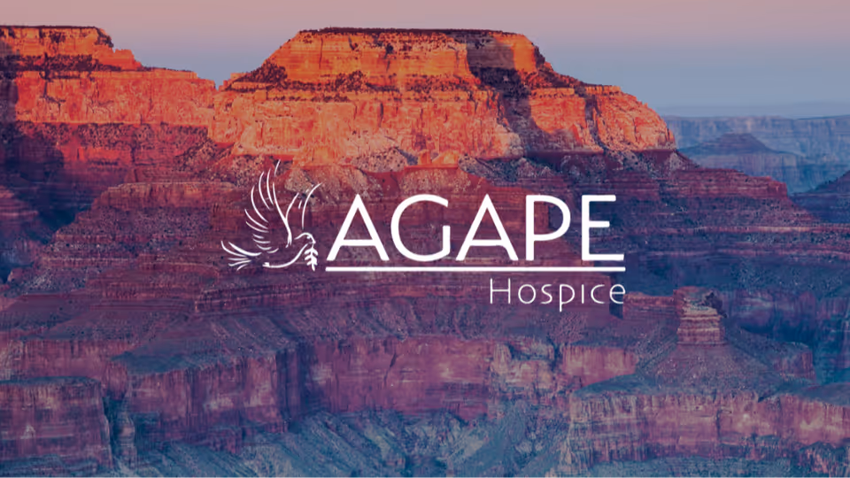 Sunset canyon landscape with AGAPE Hospice logo centered across the scene.