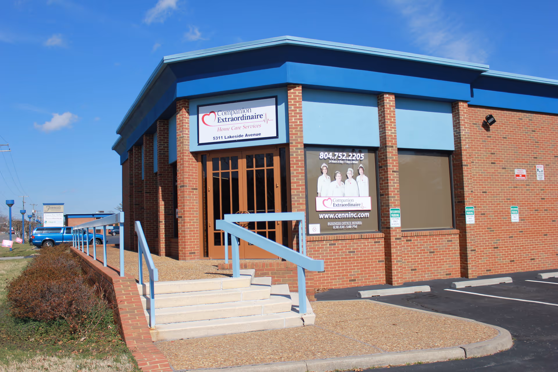 Brick building with blue trim and a ramped entrance for Companion Extraordinaire Home Care Services.