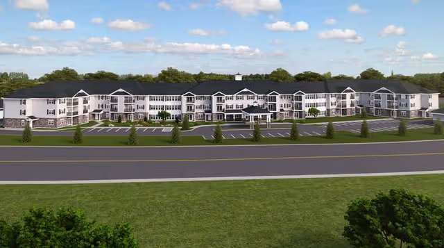 Exterior view of Summit at Mill Hill, a large multi-wing senior living campus.