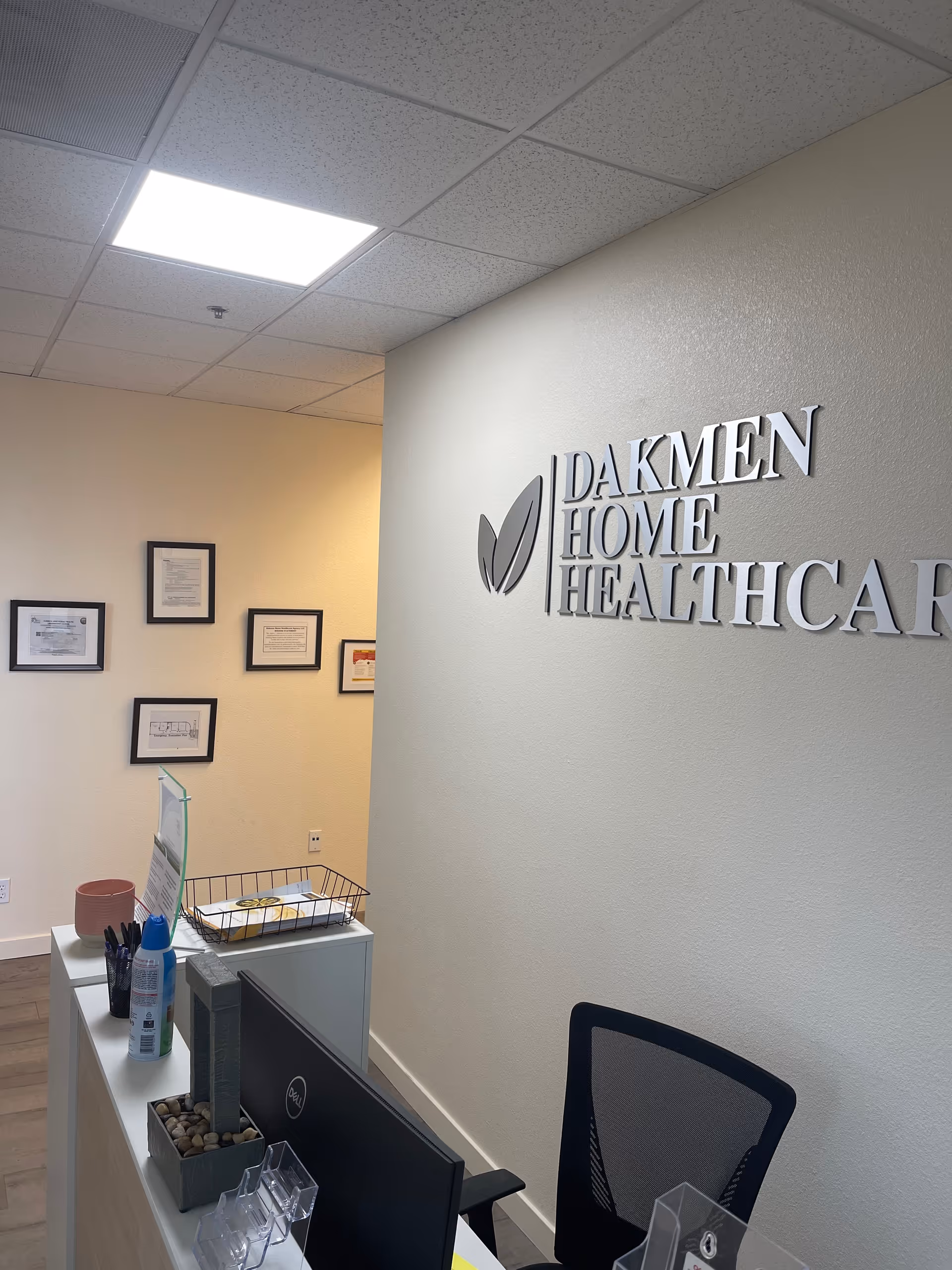 Reception area with Dakmen Home Healthcare sign on the wall.