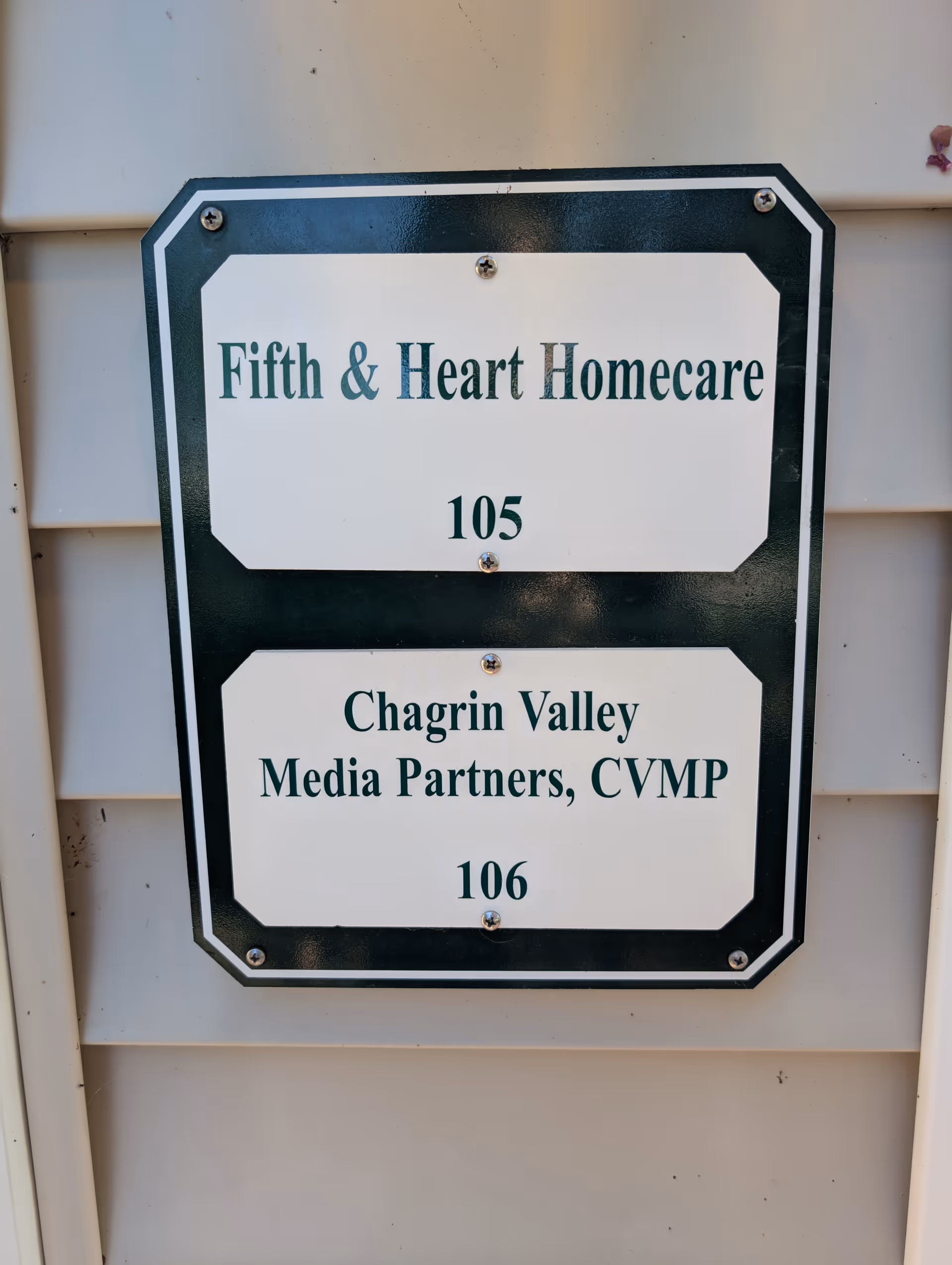 Exterior building sign displays Fifth & Heart Homecare with room numbers 105 and 106