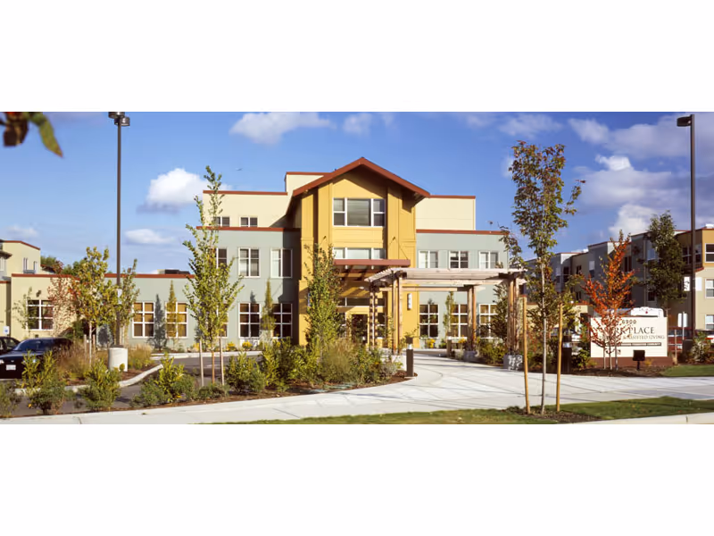 Park Place senior living center exterior with entrance and landscaped walkway.