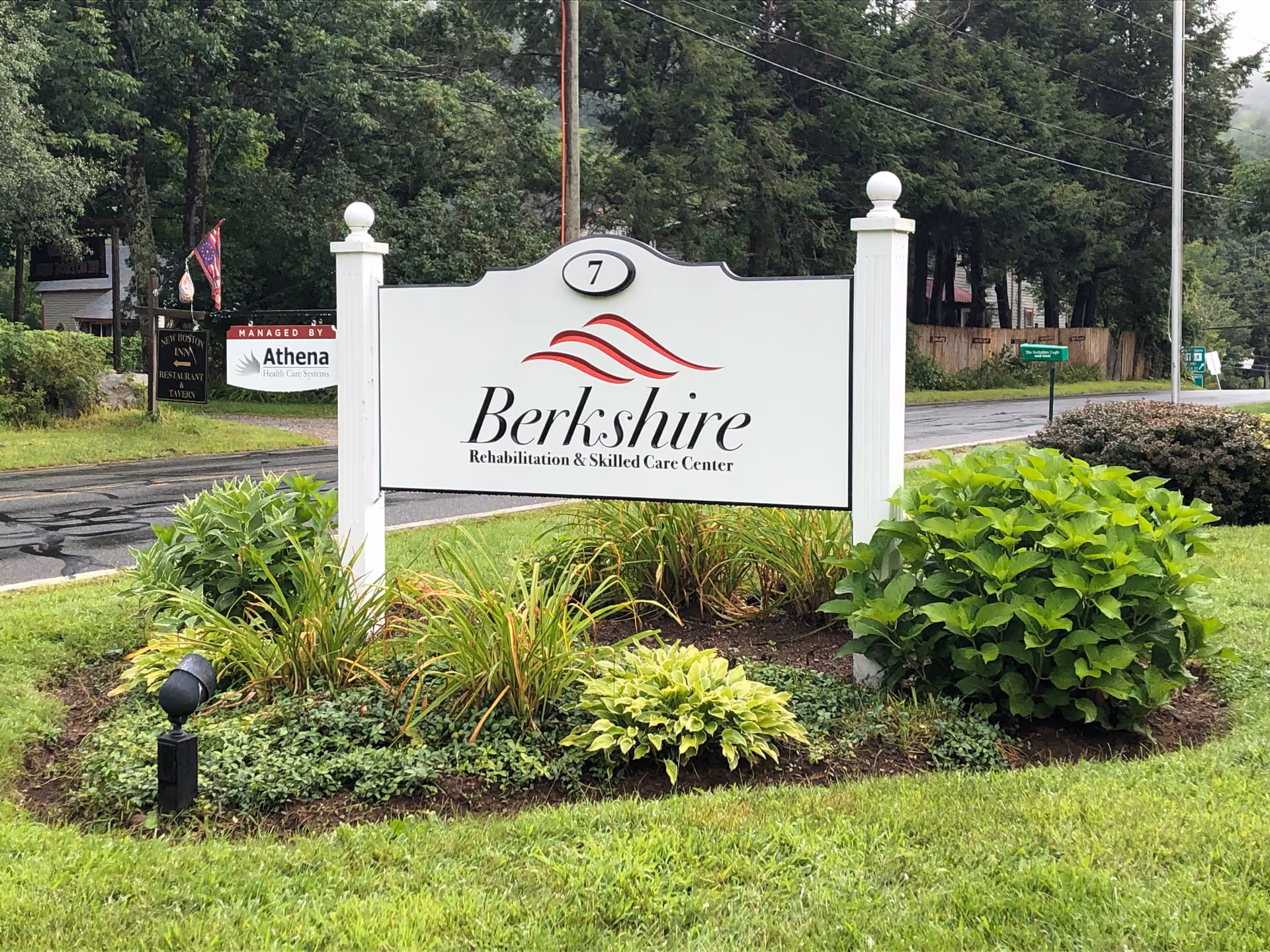 Berkshire sign with lush landscaping at the front of a care center