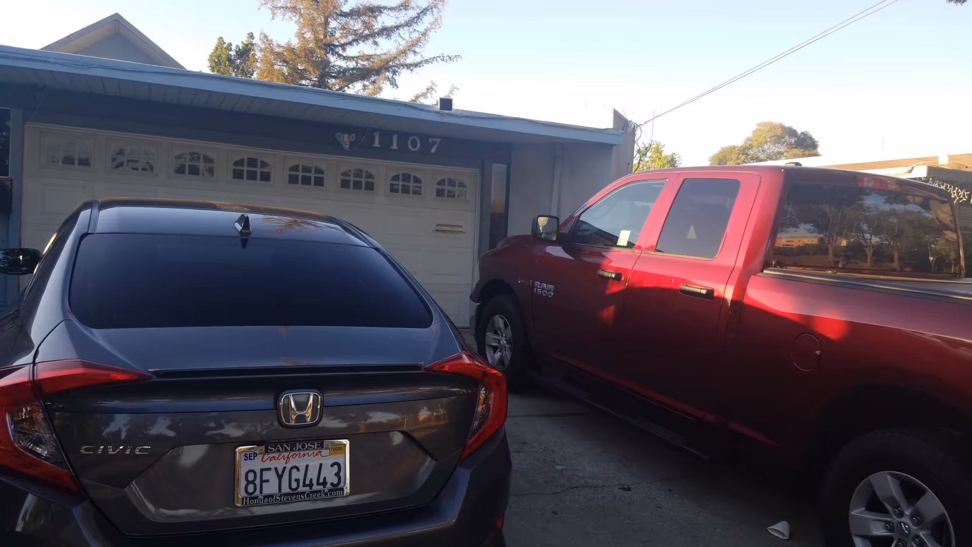 Exterior view of Magdalene Residential Care with two parked cars in the driveway.