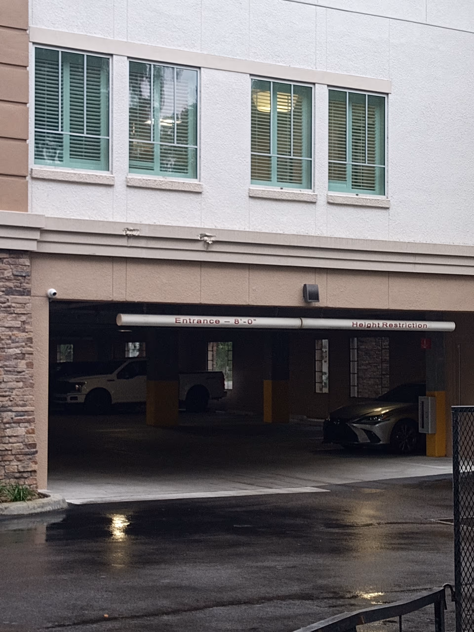 Exterior view of Delaney Park Health and Rehabilitation Center showing a covered parking entrance.