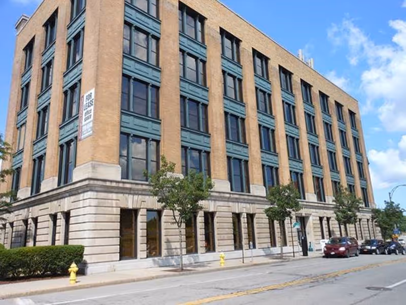 Exterior view of the Greater Rochester Health Home Network building along a city street.