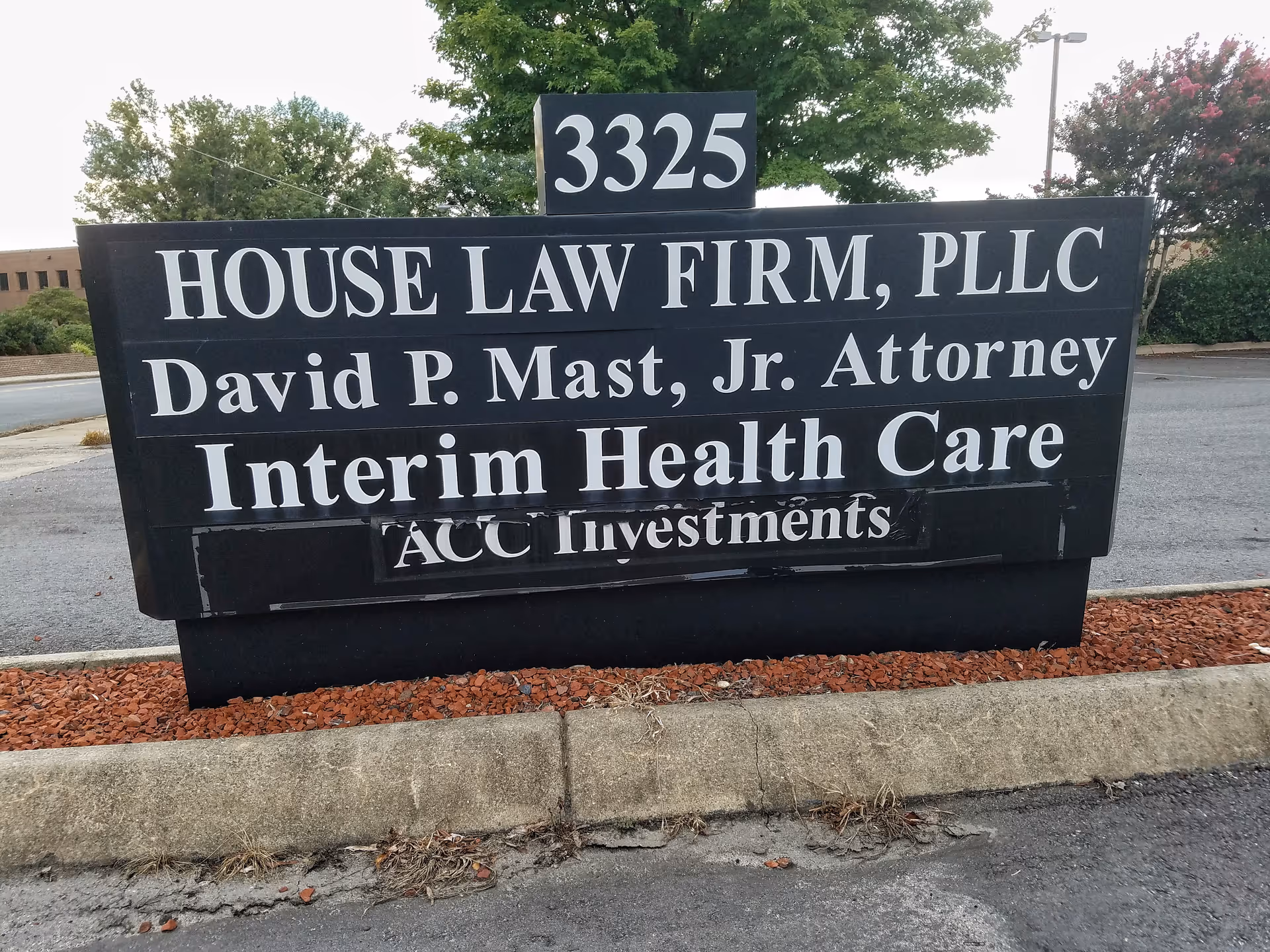 A large outside sign reads 'House Law Firm, PLLC' with 'Interim Health Care' text.