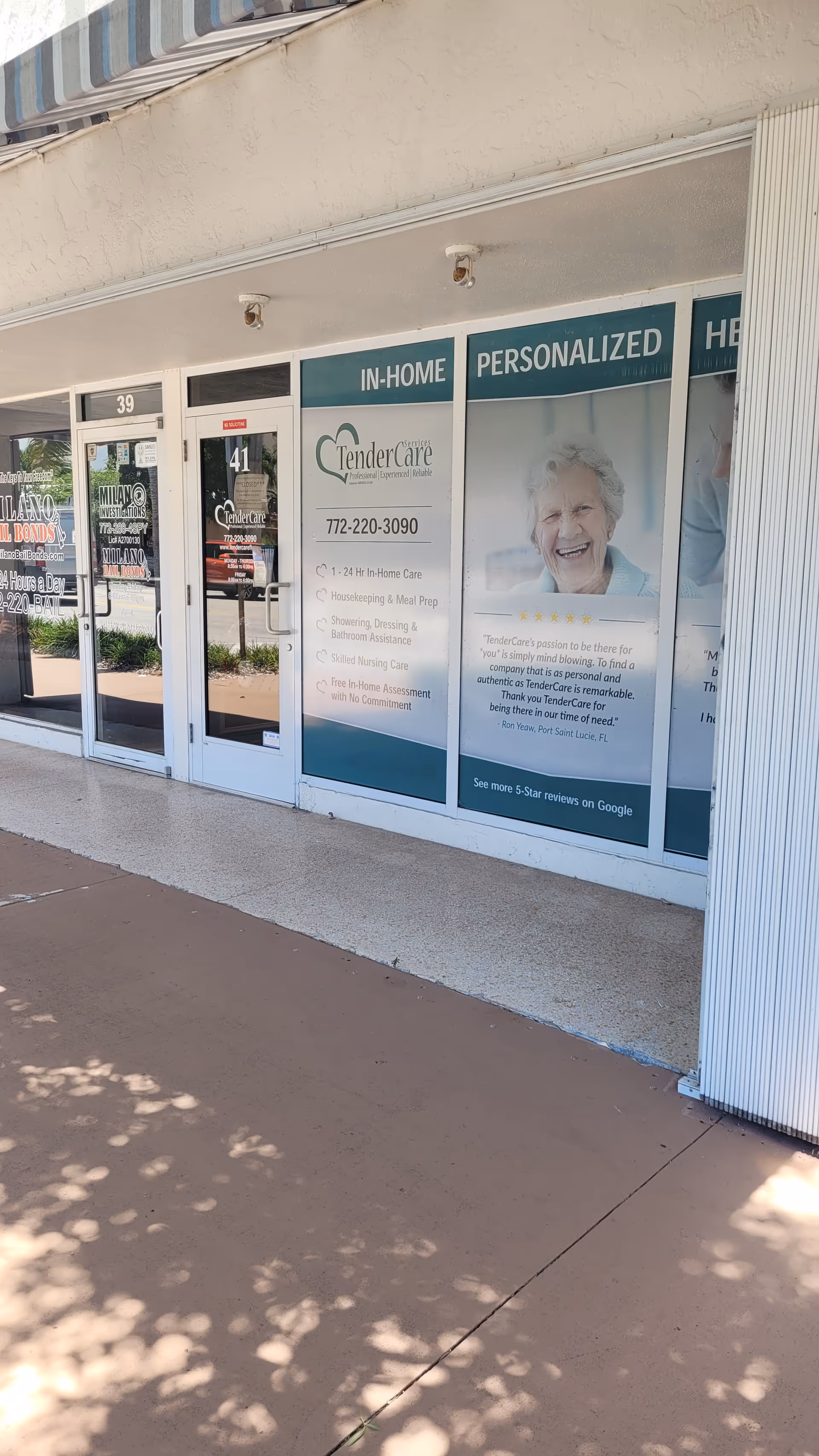 Storefront of TenderCare senior care facility with glass doors and window advertisements.