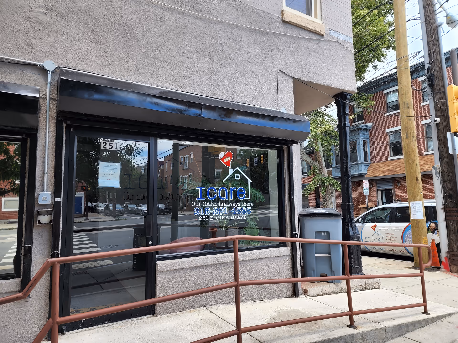 Exterior view of ICare Home Health storefront with glass doors.