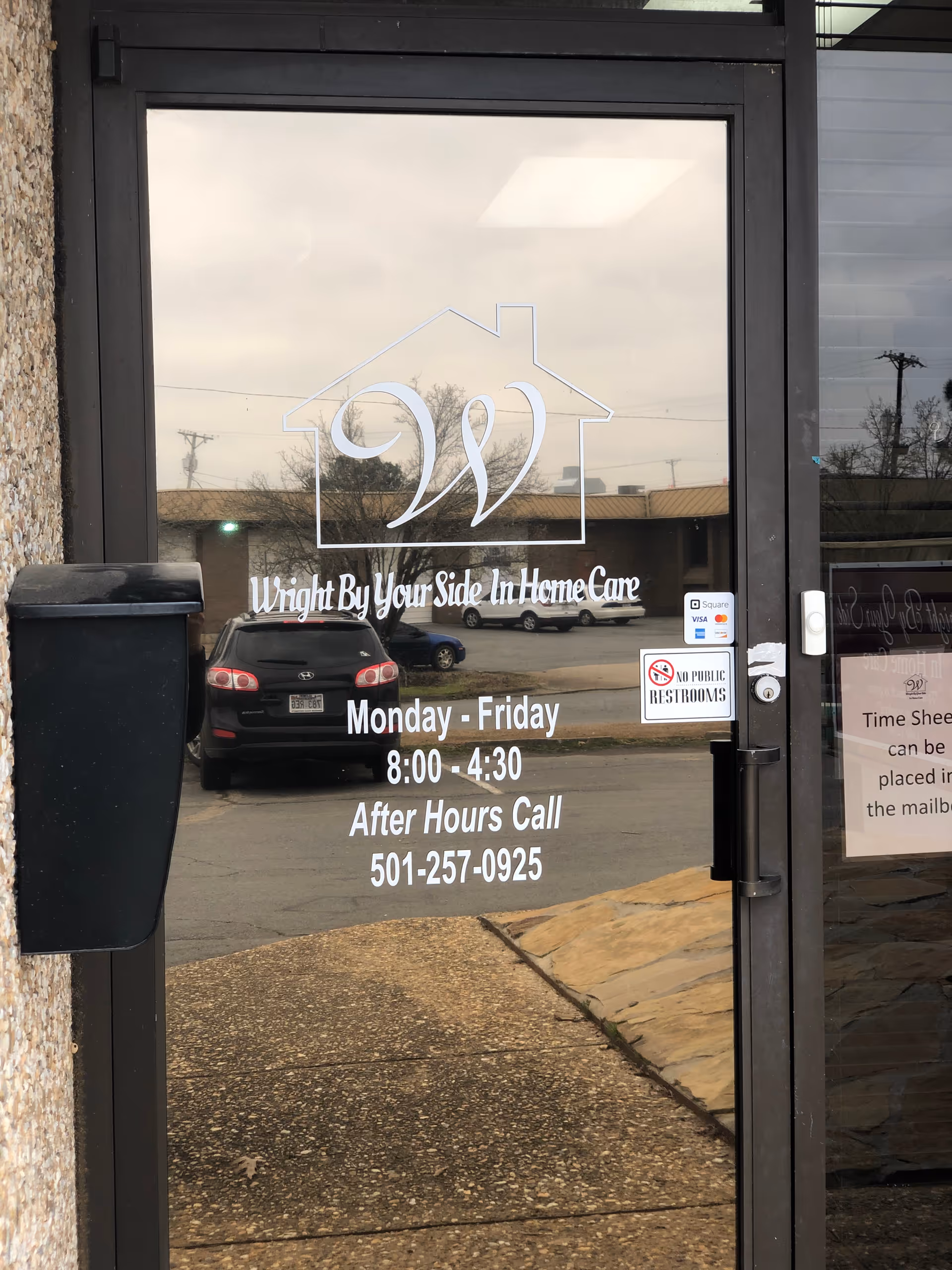 Glass front door with Wright By Your Side In Home Care logo and hours.