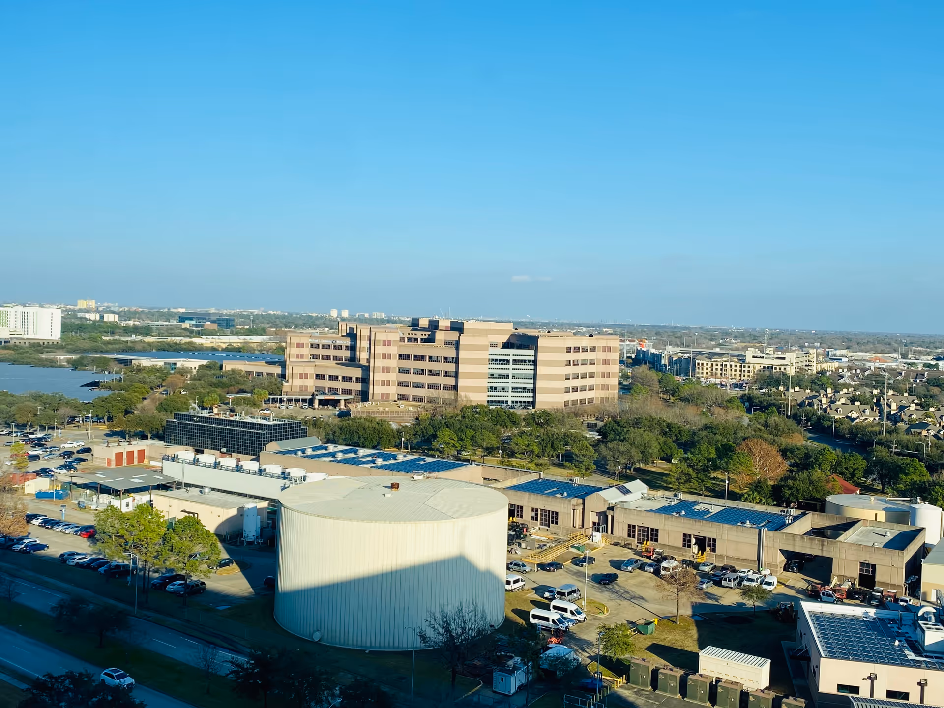 An aerial view of Michael E. DeBakey VA Medical Center campus with multiple buildings and parking.