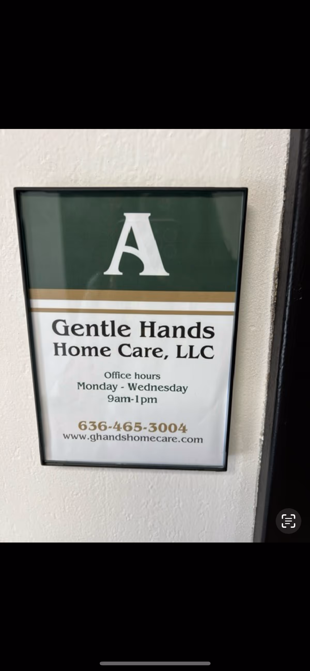 Framed sign on wall displays Gentle Hands Home Care, LLC contact information.
