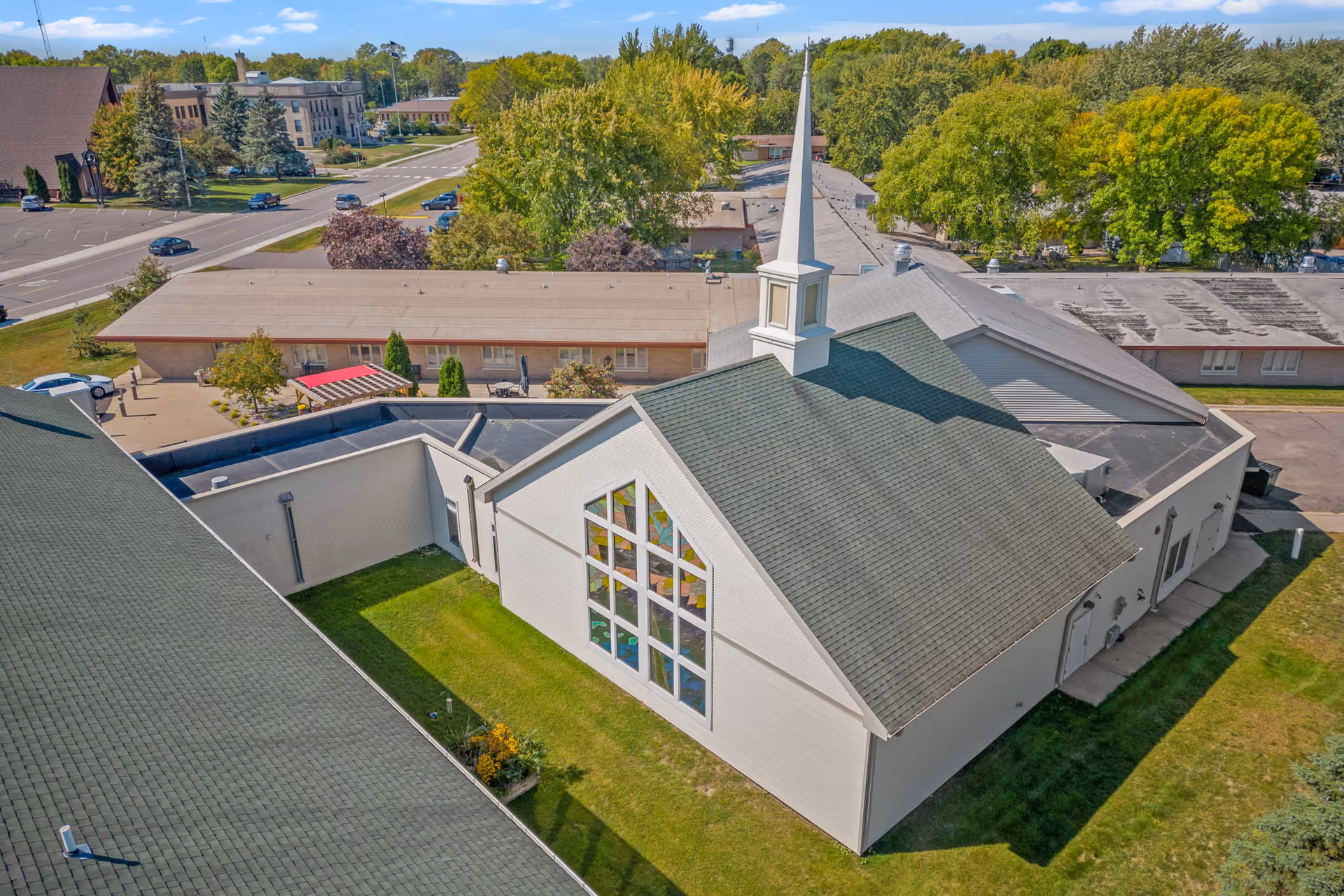 Aerial view of Elim Home - Milaca exterior building with a tall steeple