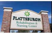 Brick-and-stone sign with brick pillars reads Plattsburgh Rehabilitation and Nursing Center.