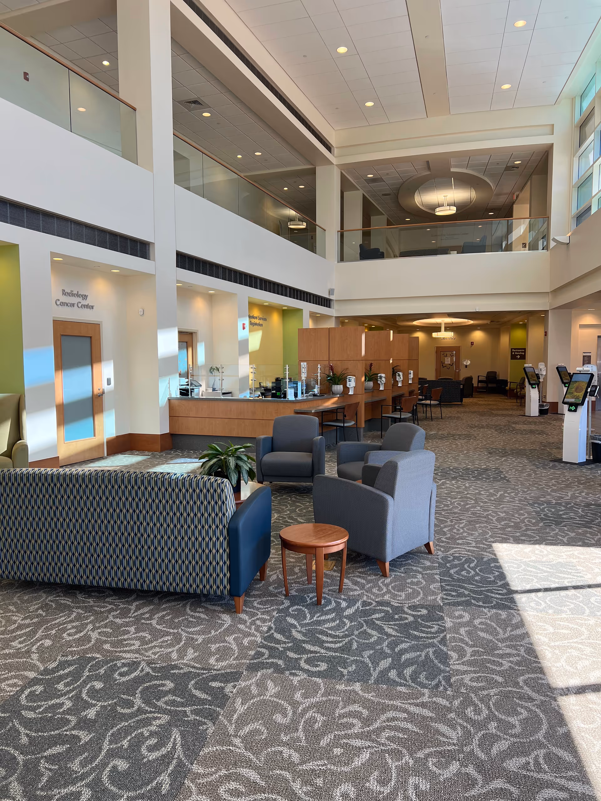 Middlesex Health Shoreline Medical Center lobby with seating and upper-level balcony.