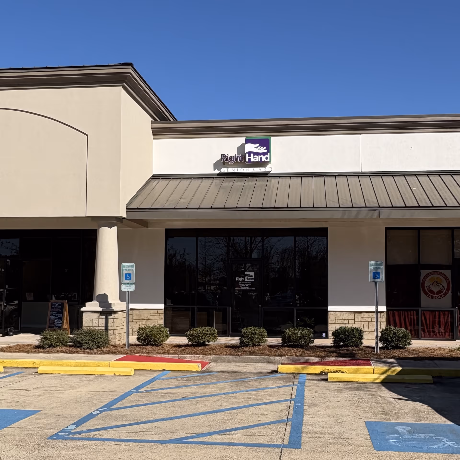 Exterior view of Right Hand Senior Care facility, storefront, parking, and landscaping.