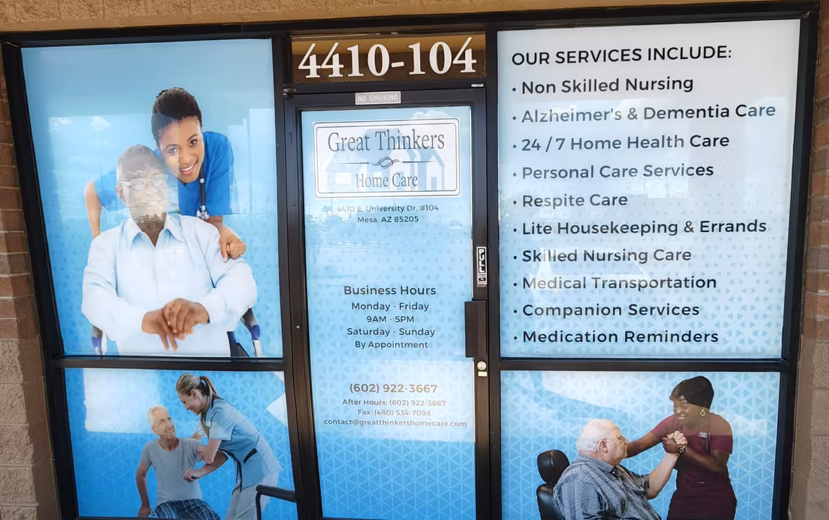 Storefront with large blue signage for Great Thinkers Home Care and caregiver images.