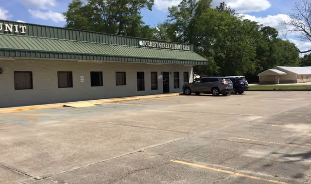 Front view of Forrest General Home Care and Hospice Richton office with parked cars.
