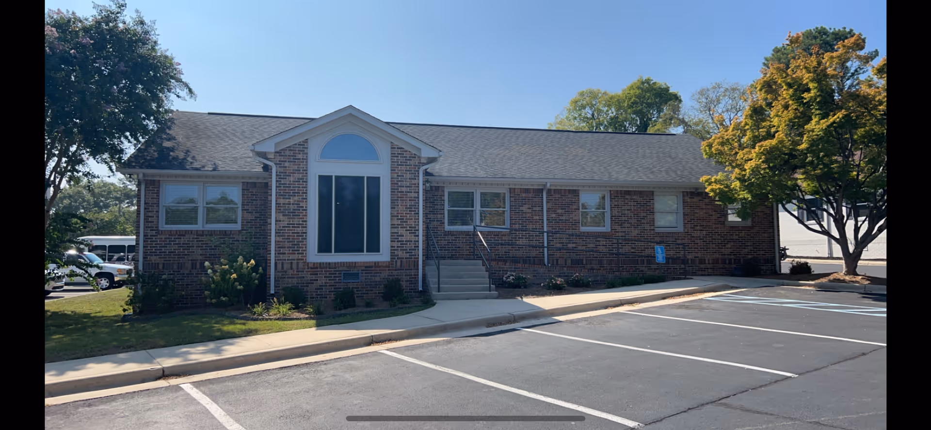 Exterior view of Sunbridge Home Health Care, Inc. building with entrance and parking.