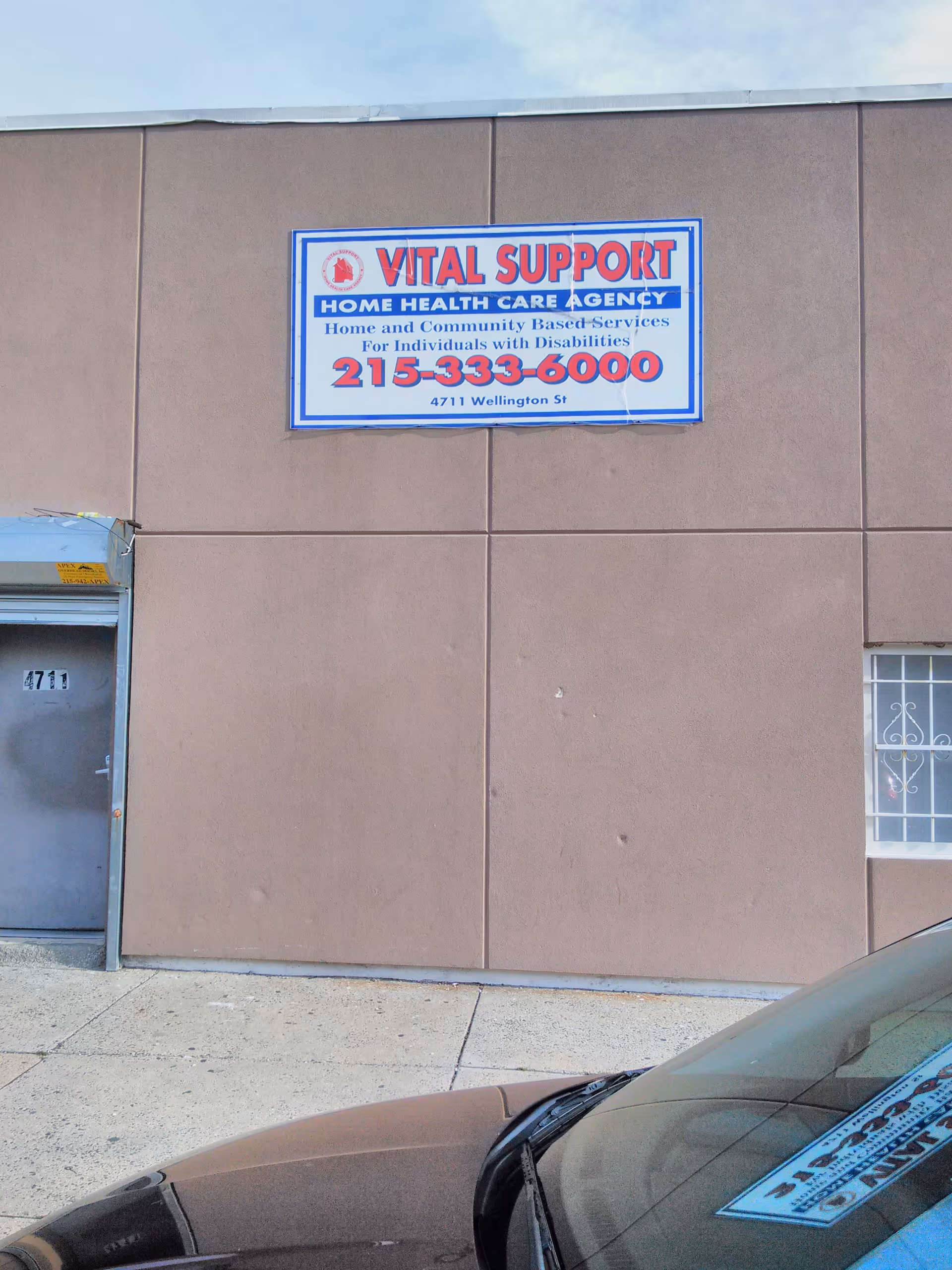 Exterior view of a brown building with a Vital Support Home Health Care sign.