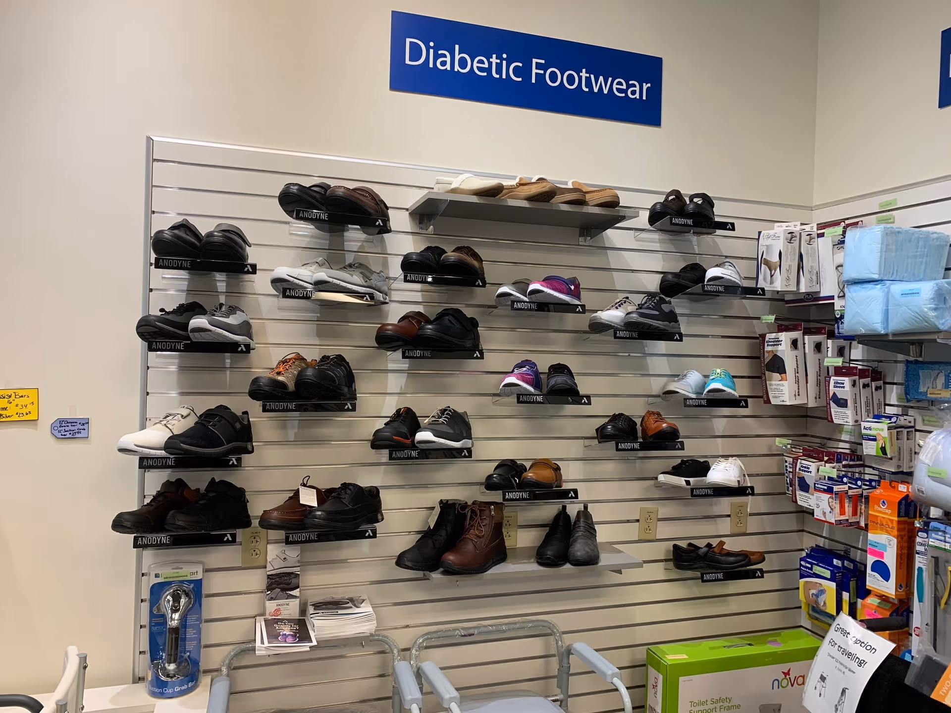 Interior store display of diabetic footwear on wall shelves