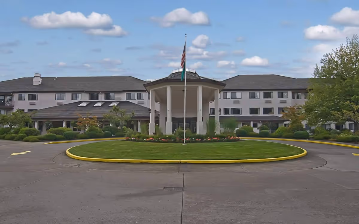 Solstice Senior Living at Bellingham exterior with circular driveway and manicured landscaping