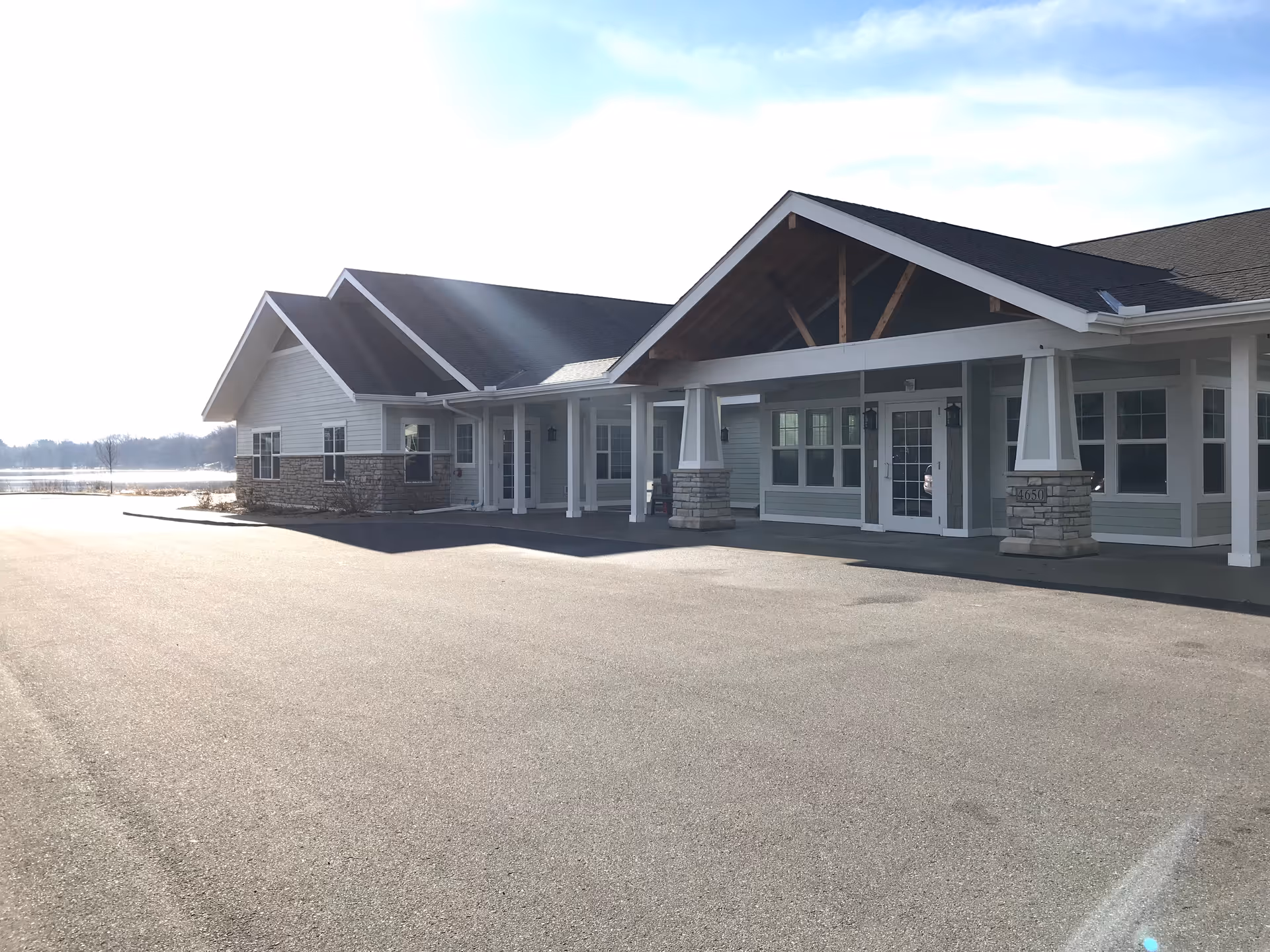 Exterior view of Prelude Homes and Services I with a covered entrance and parking.
