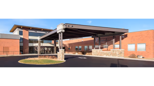 Exterior view of St. Charles Madras facility with brick walls and a covered entrance.