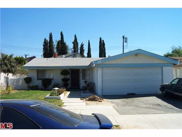Front exterior of a single-story building with a two-car garage.