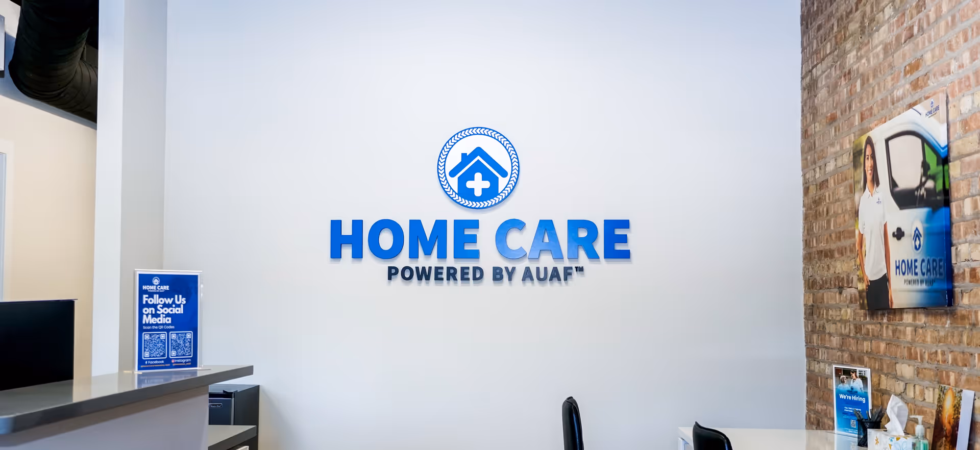Reception area featuring a large Home Care sign on a white wall.