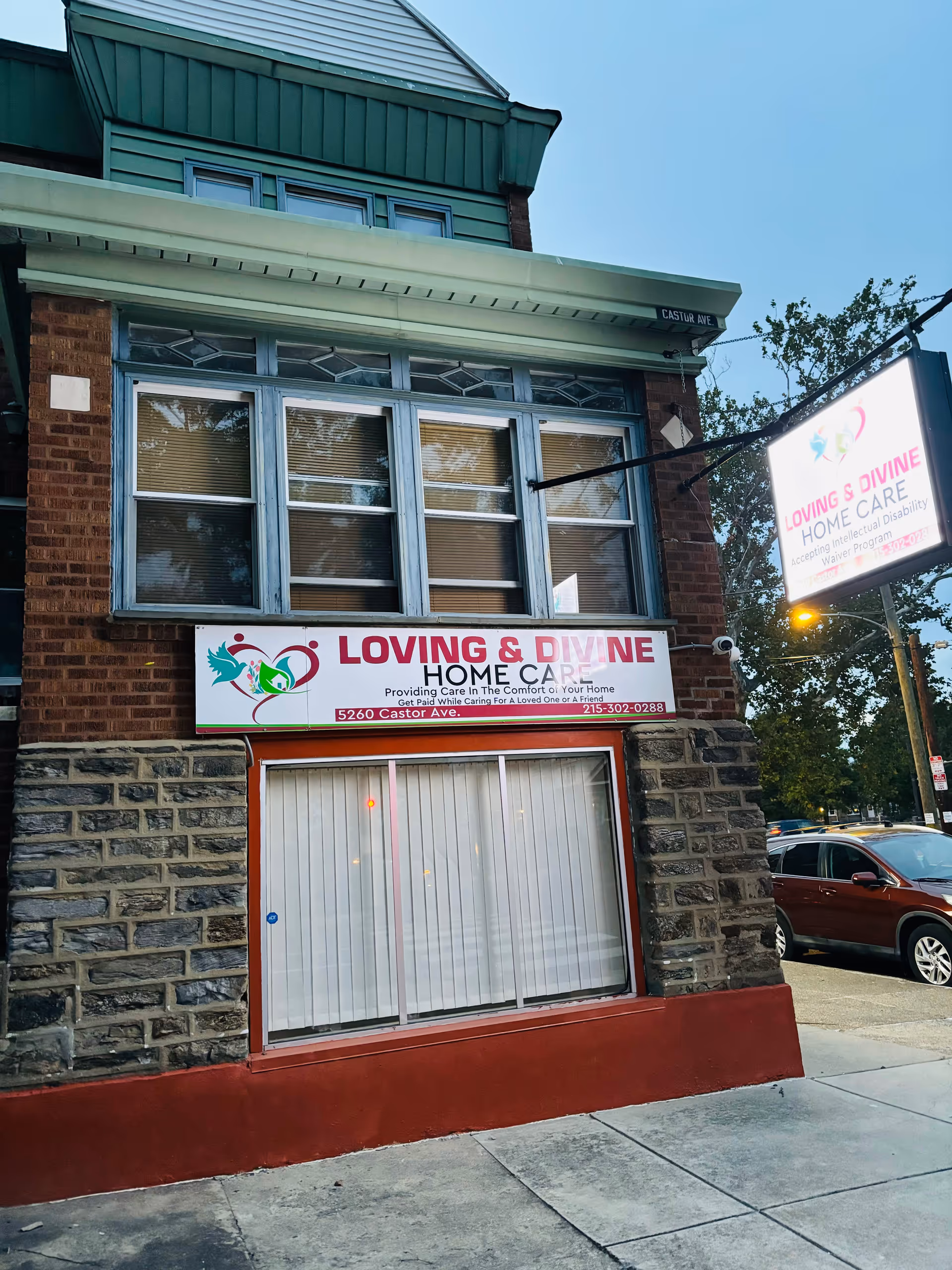Loving & Divine Home Care storefront on a brick building exterior.