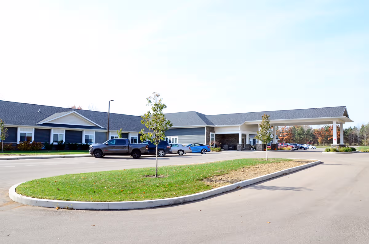 Exterior view of Laurel Oaks of South Haven showing the entrance and parking.
