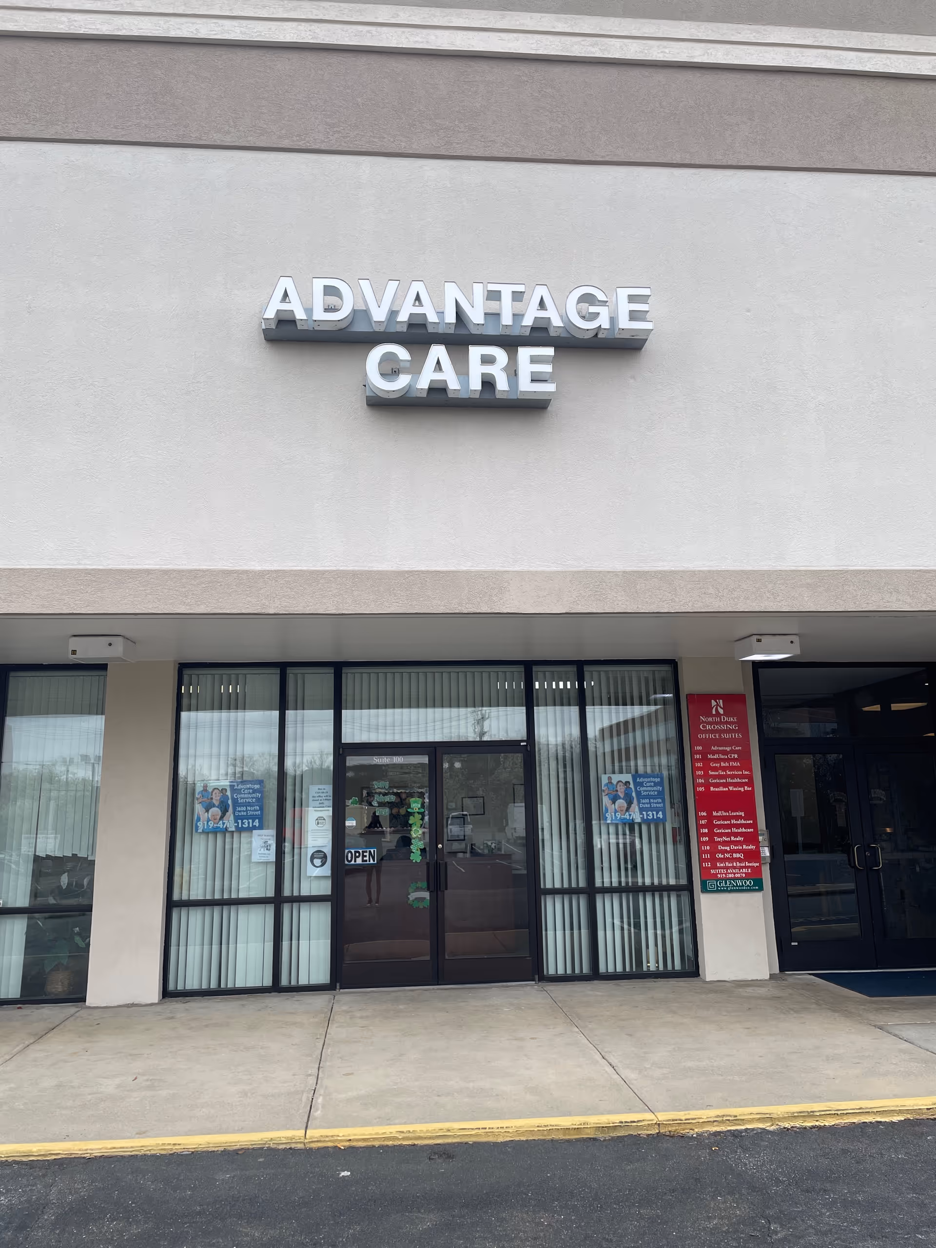 Front exterior of Advantage Care facility with glass doors and signage.