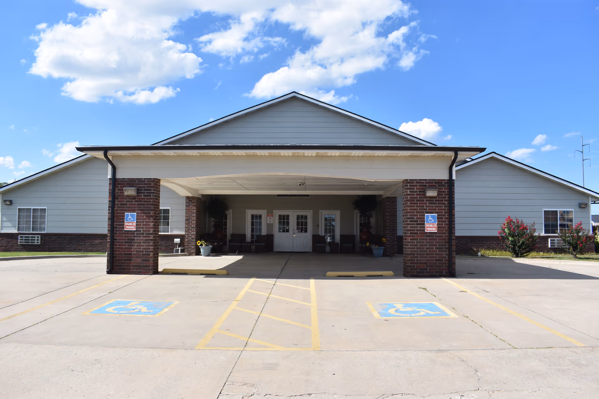 Featherstone Assisted Living entrance with handicap parking and a wide covered drop-off.