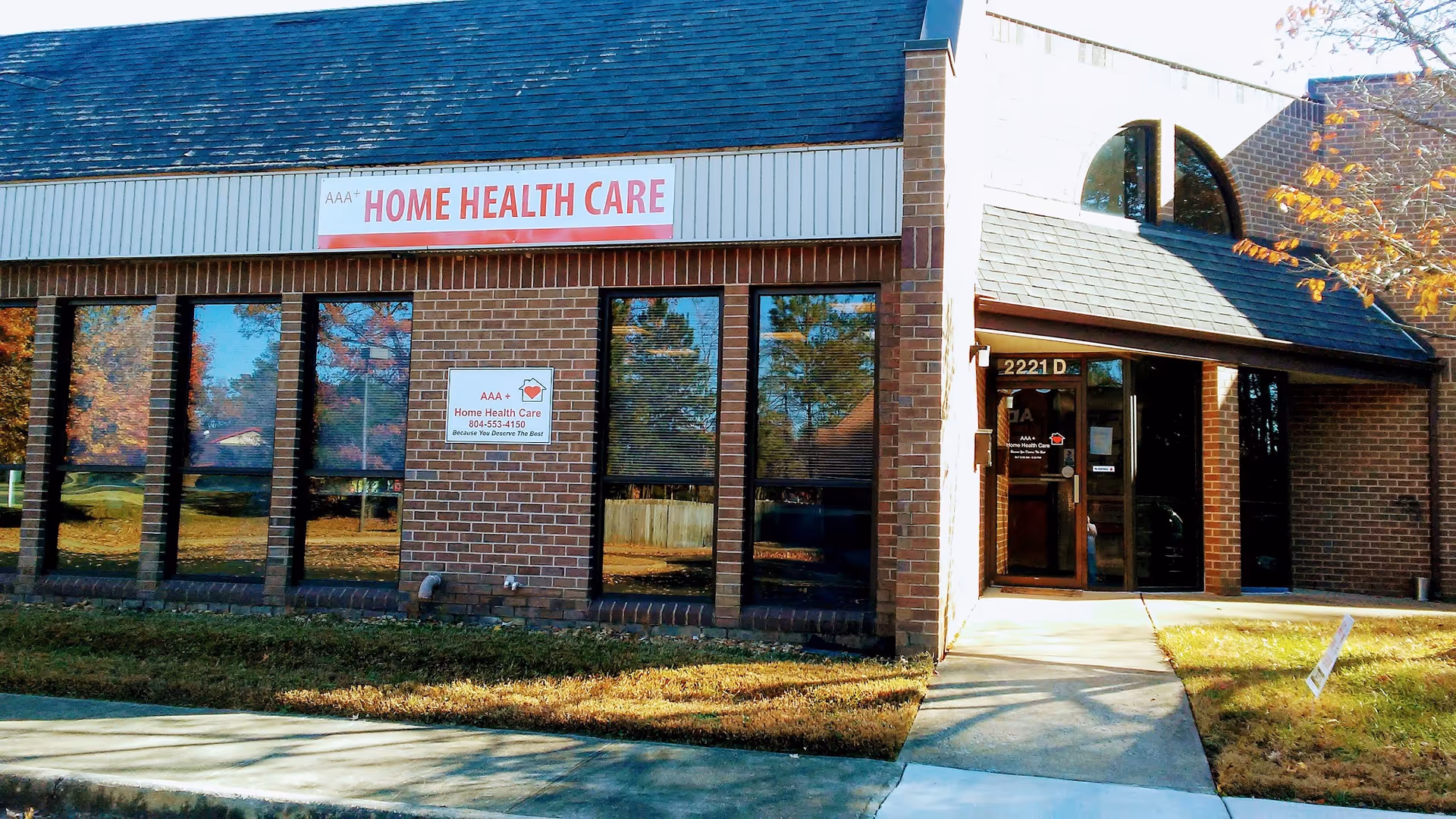 Exterior view of a brick building with a sign reading AAA Home Health Care.