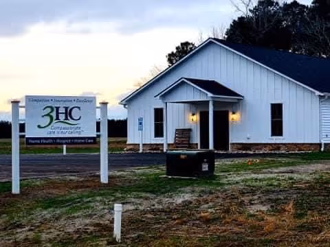 Front exterior of the 3HC facility with sign and welcoming entrance.