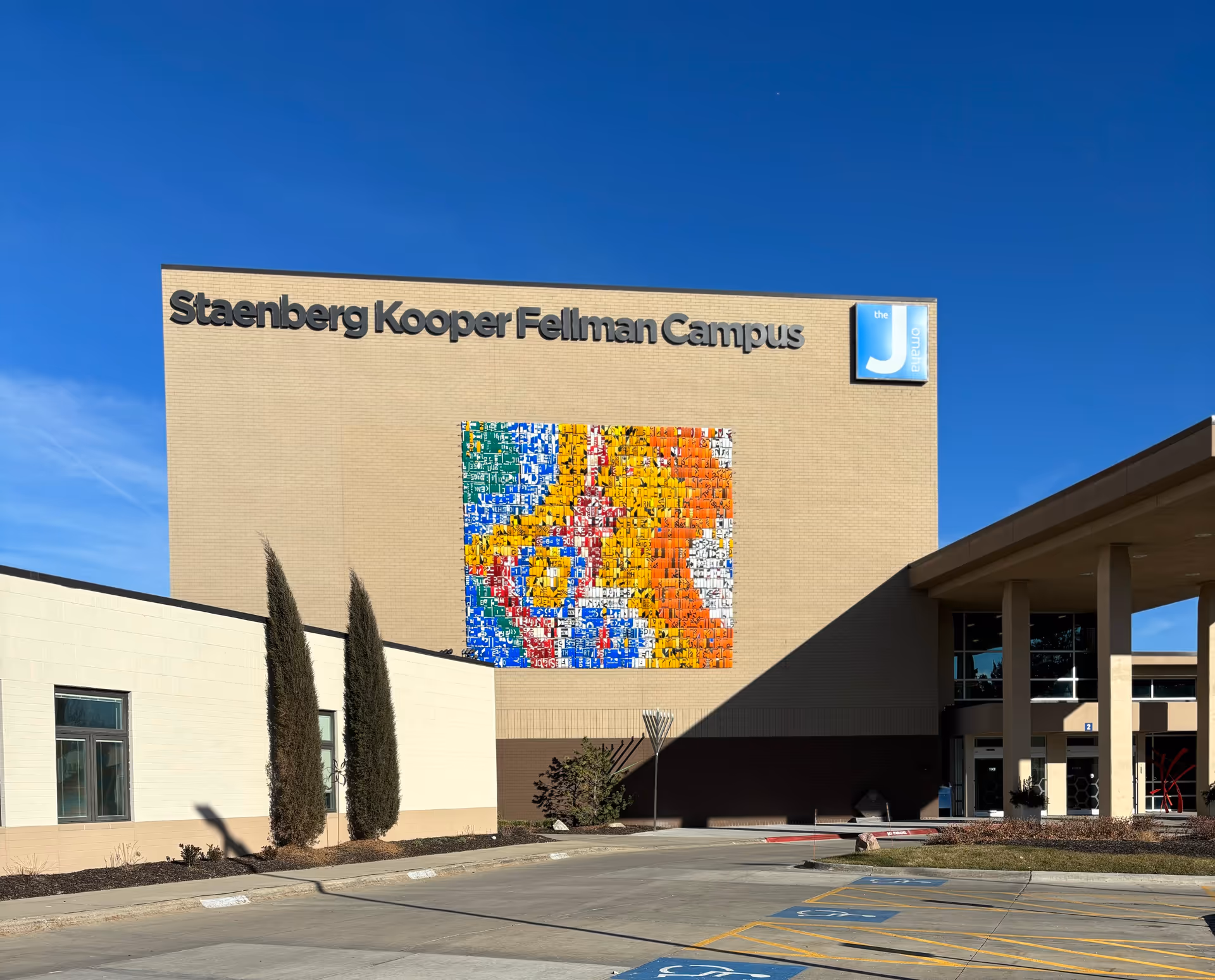 Exterior of Staenberg Kooper Fellman Campus building against a clear blue sky.